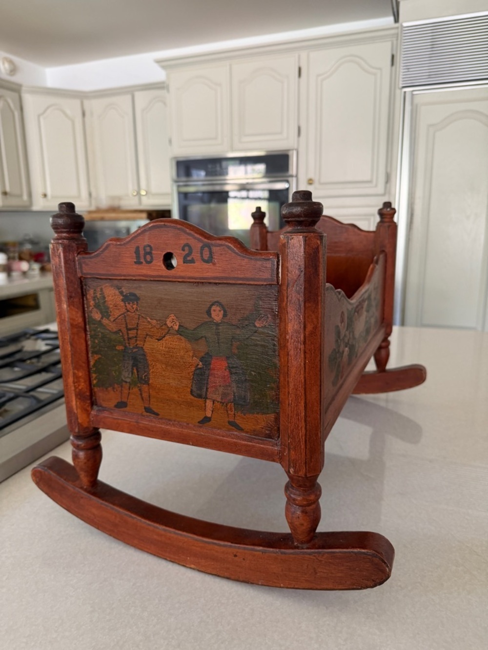 Antique Handcarved Wooden Rocking Cradle with Hand-Painted Couple